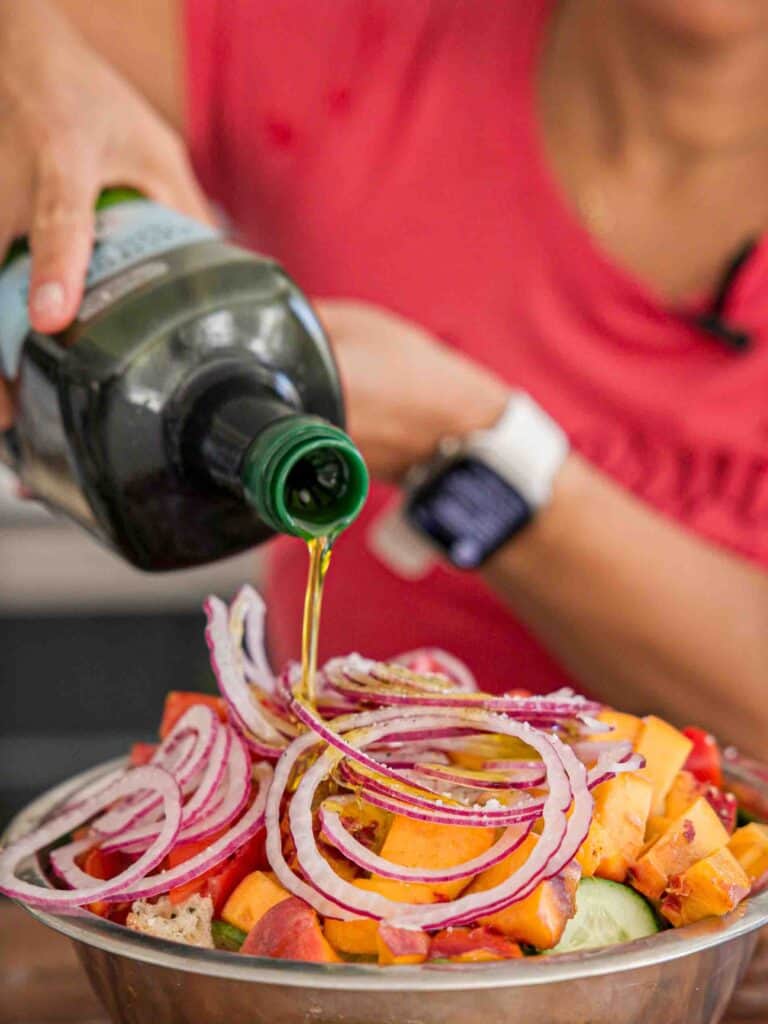 10-Minute Easy Bread Salad Recipe - Peach Panzanella. 19 adding-olive-oil-to-bread-salad