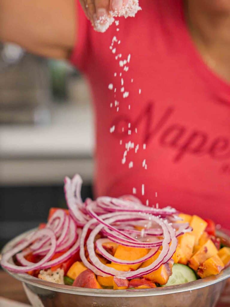 10-Minute Easy Bread Salad Recipe - Peach Panzanella. 16 adding-salt-to-bread-salad