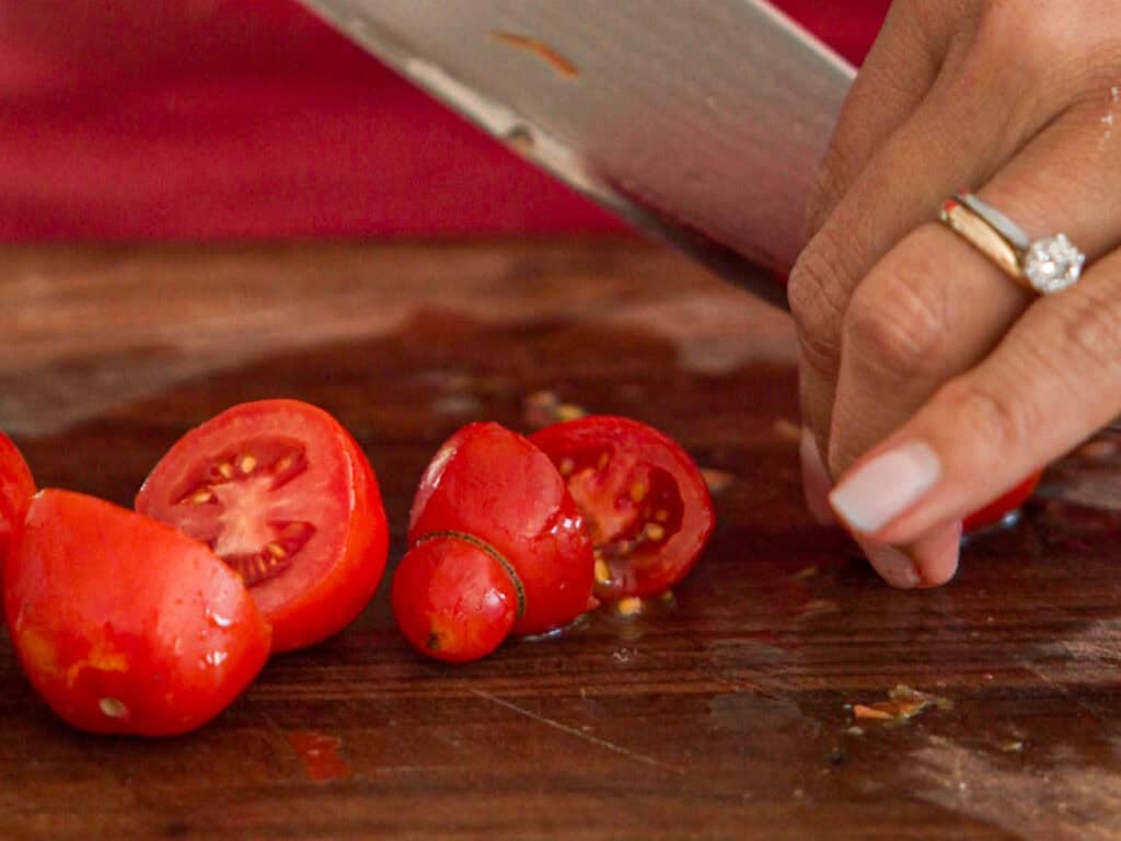 10-Minute Easy Bread Salad Recipe - Peach Panzanella. 13 chopping-cherry-tomatoes-in-half