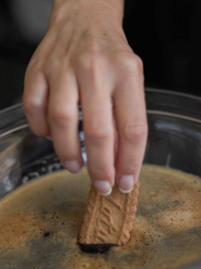 Super Easy and DELICIOUS Vegan Biscoff-Misu Recipe. 14 dipping-biscoff-cookie-into-espresso-syrup-scaled