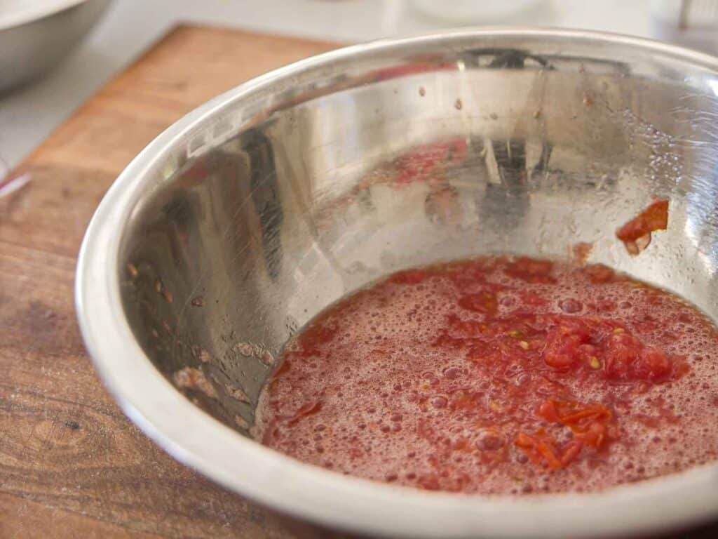 10-Minute Easy Bread Salad Recipe - Peach Panzanella. 10 grated-tomato-in-bowl