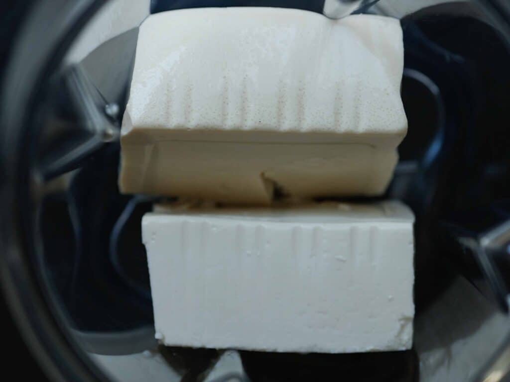 Super Easy and DELICIOUS Vegan Biscoff-Misu Recipe. 9 overhead-shot-of-soft-tofu-in-blender