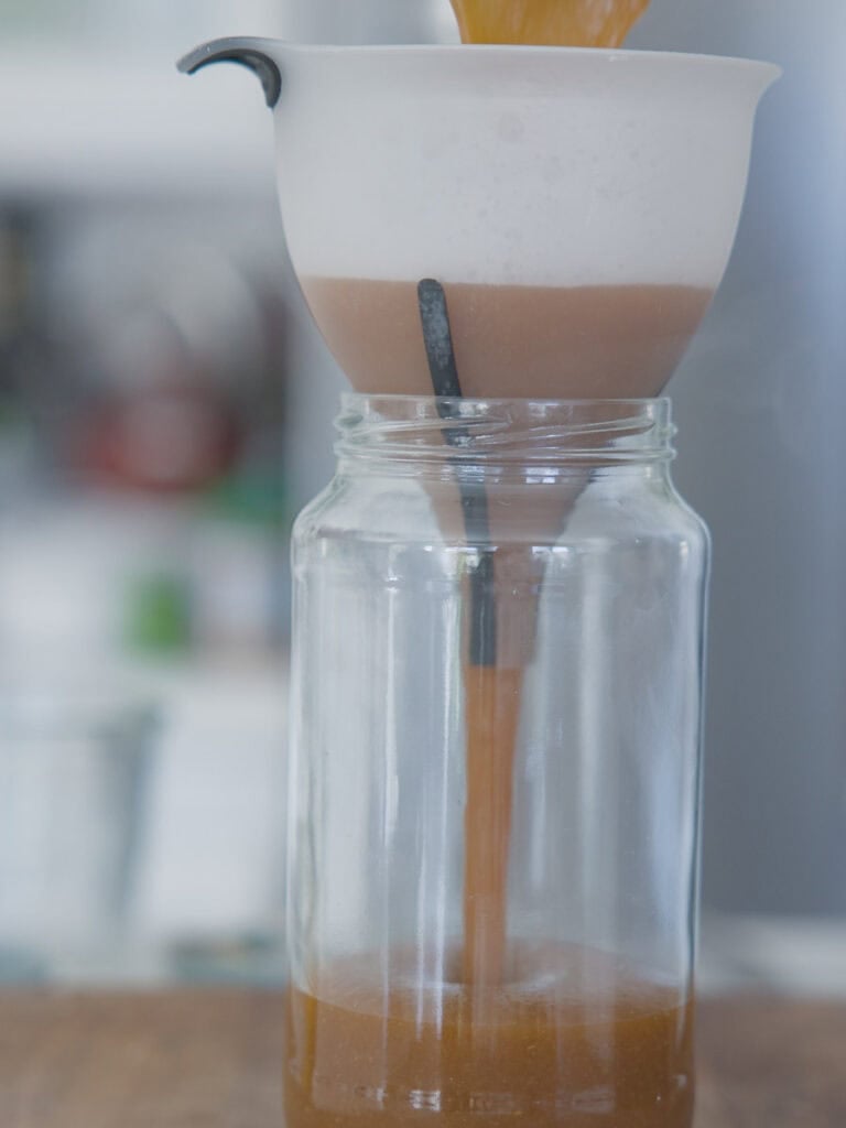 My Mom's Easy and Authentic Korean BBQ Sauce Recipe. 14 pouring-korean-bbq-sauce-into-jar-through-funnel