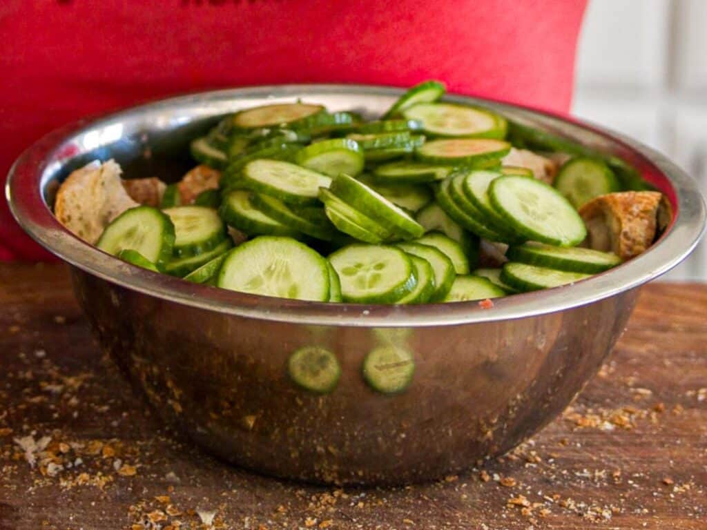 10-Minute Easy Bread Salad Recipe - Peach Panzanella. 15 sliced-cucumbers-in-bowl-with-bread