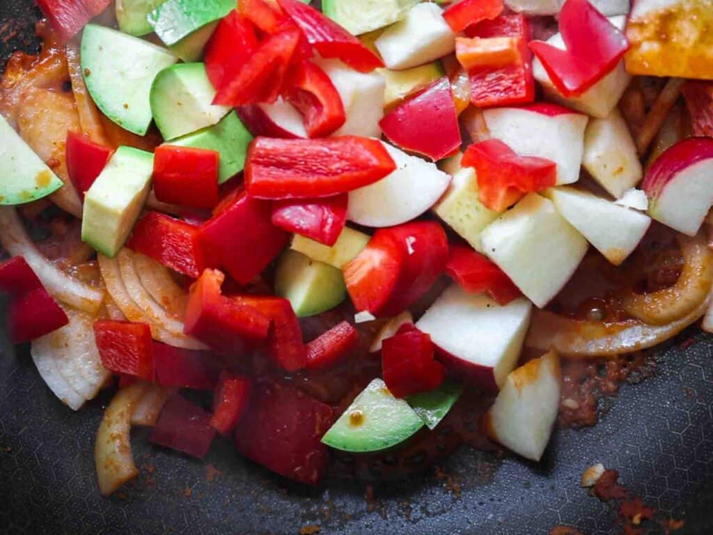 Hi-Protein Delicious Vegan Pumpkin Curry with Tofu. 20 veggies added to pan with curry paste