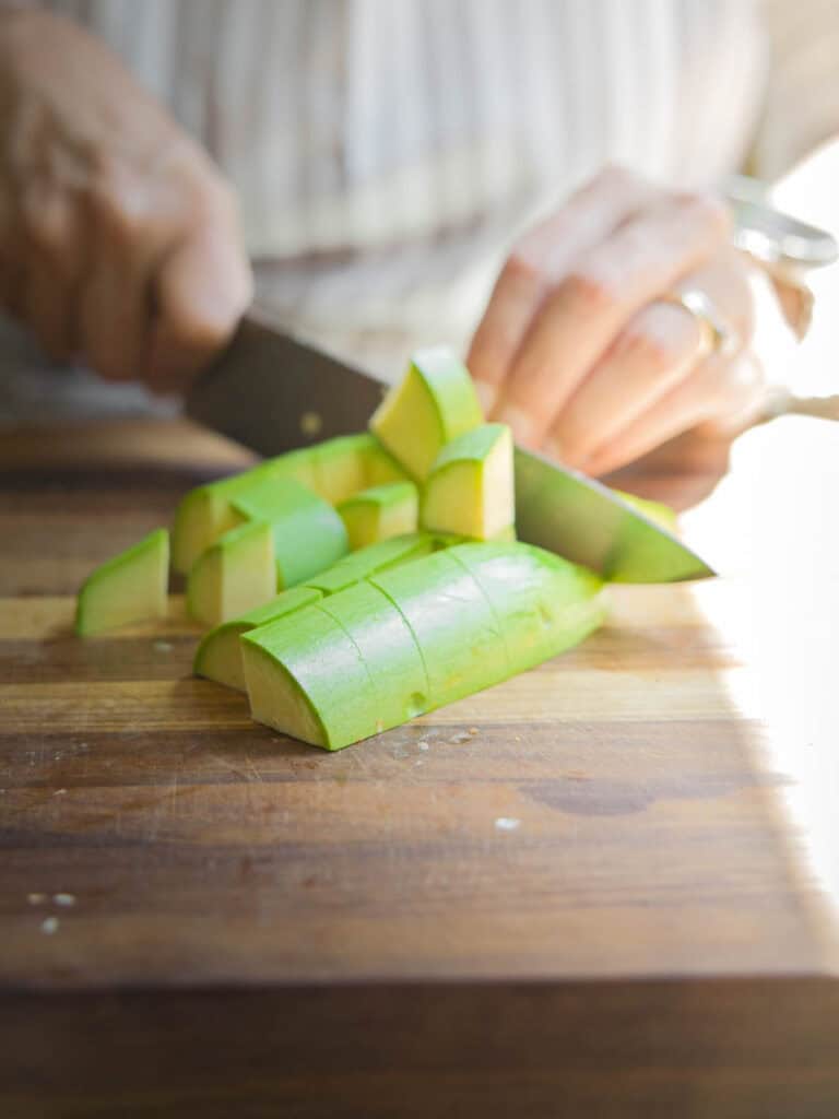 Hi-Protein Delicious Vegan Pumpkin Curry with Tofu. 10 chopping up zucchini