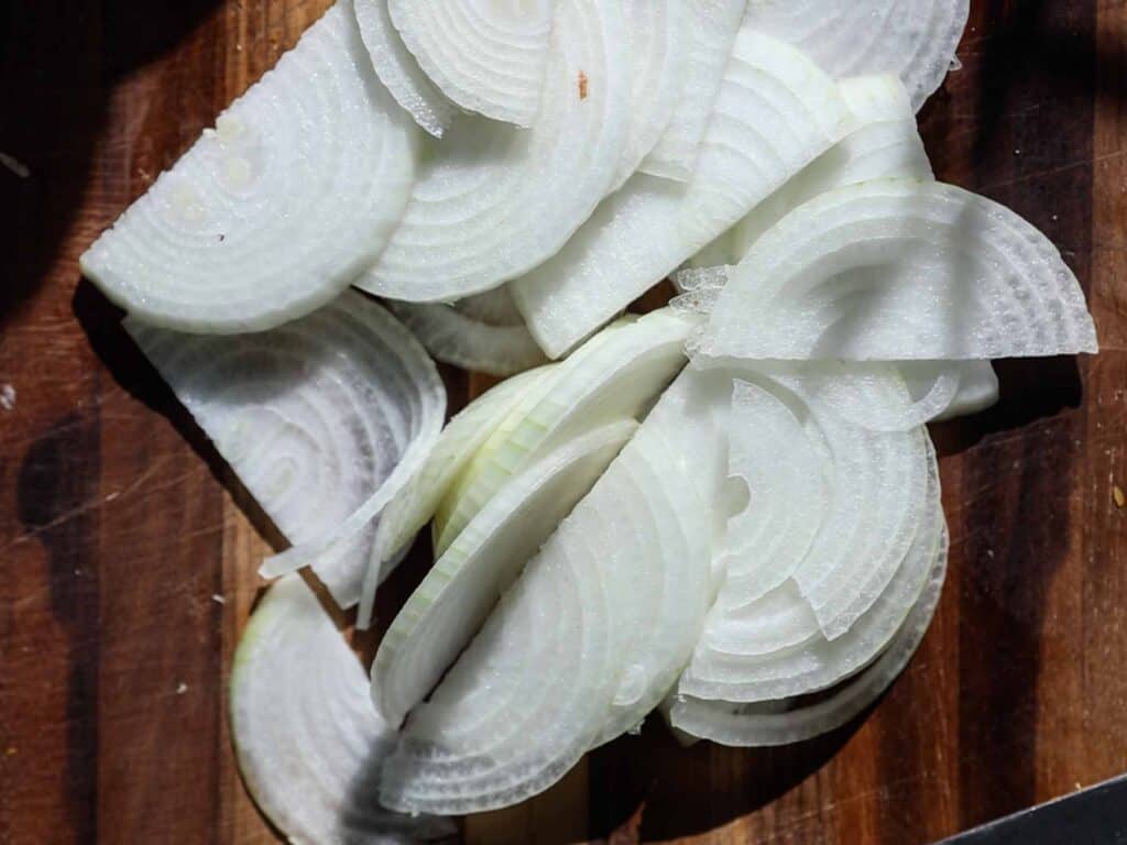 The BEST Apple Cheddar Vegan Grilled Cheese Sandwich. 8 sliced onions