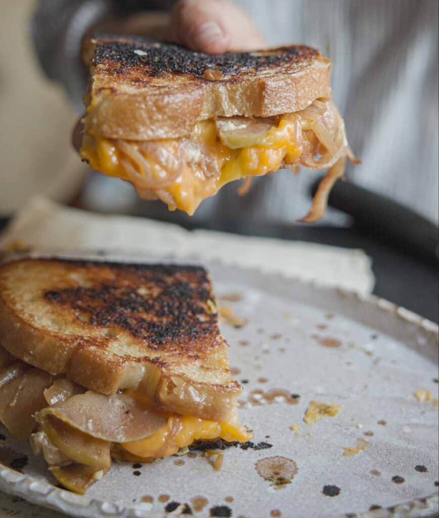 The BEST Apple Cheddar Vegan Grilled Cheese Sandwich. 27 close up image of vegan grilled cheese
