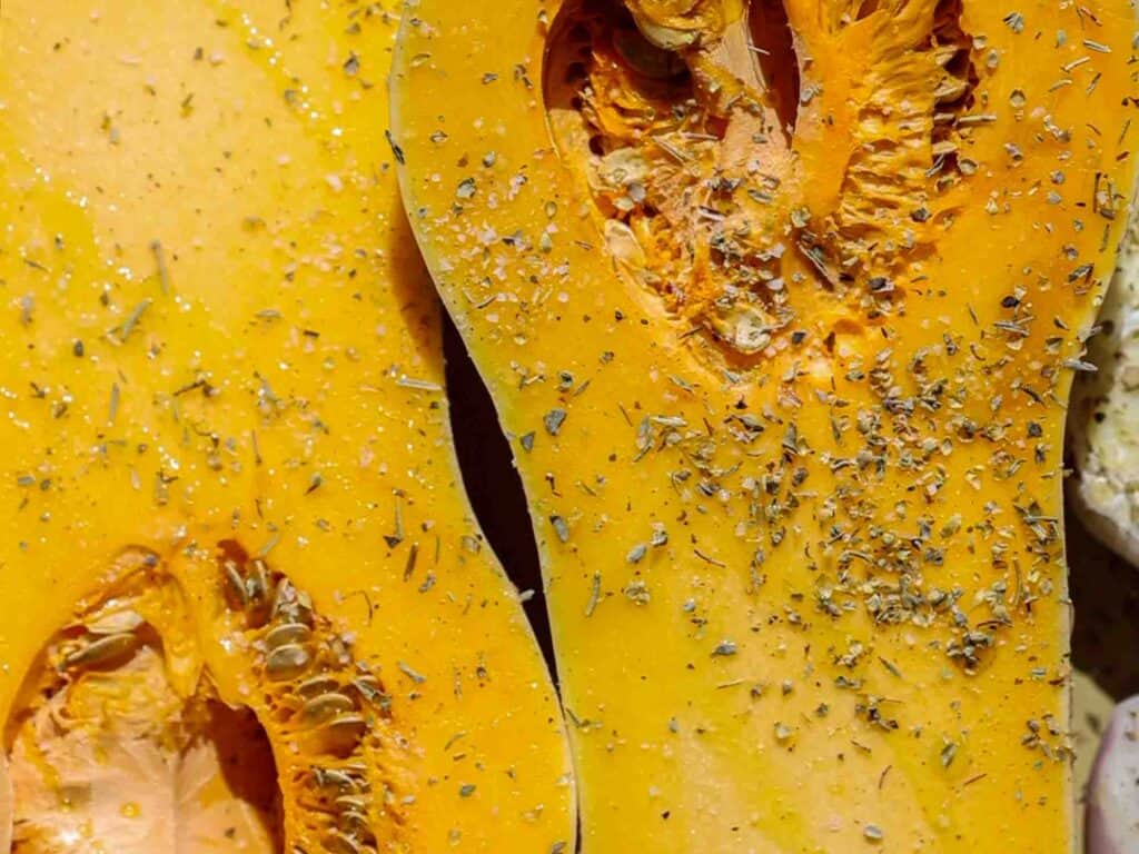 Easy and Healthy Miso & Butternut Squash Soup Recipe. 12 close up shot of seasoned butternut squash before it goes into oven
