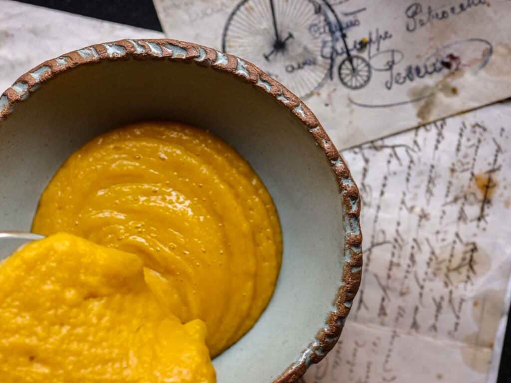 Easy and Healthy Miso & Butternut Squash Soup Recipe. 23 pouring squash soup into bowl