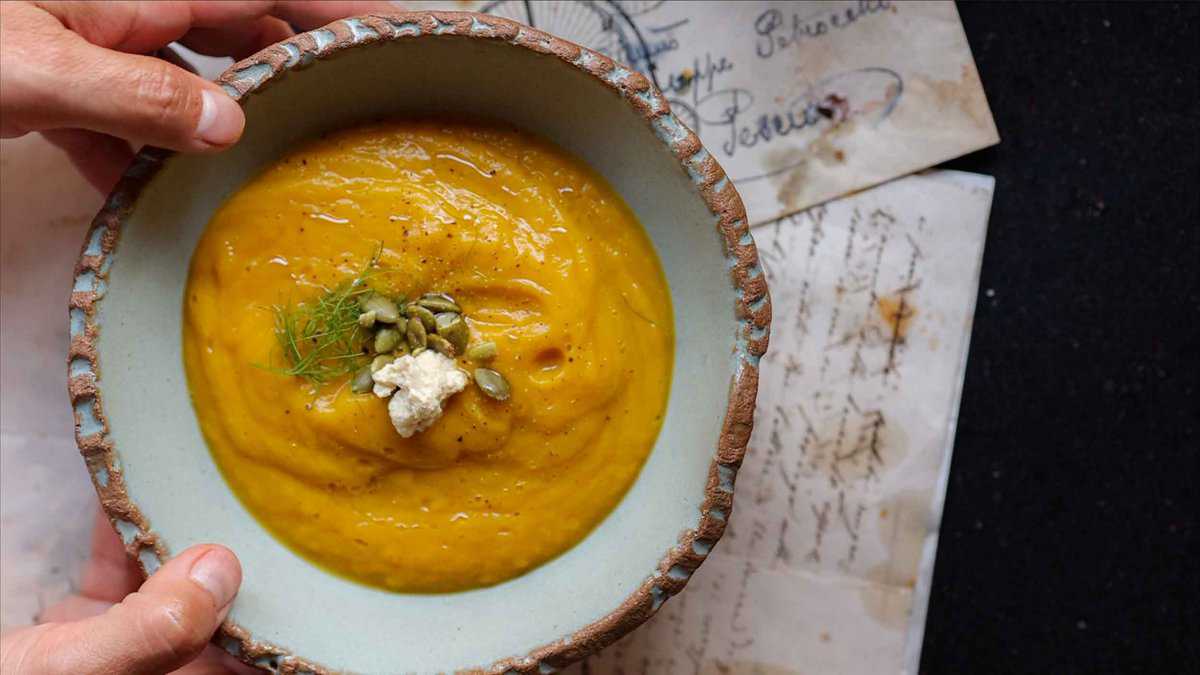 Creamy Broccoli Soup with Dumplings - delicious and Gluten-Free! 18 hero image of finished butternut squash soup with fennel fronds and pumpkin seeds and ricotta