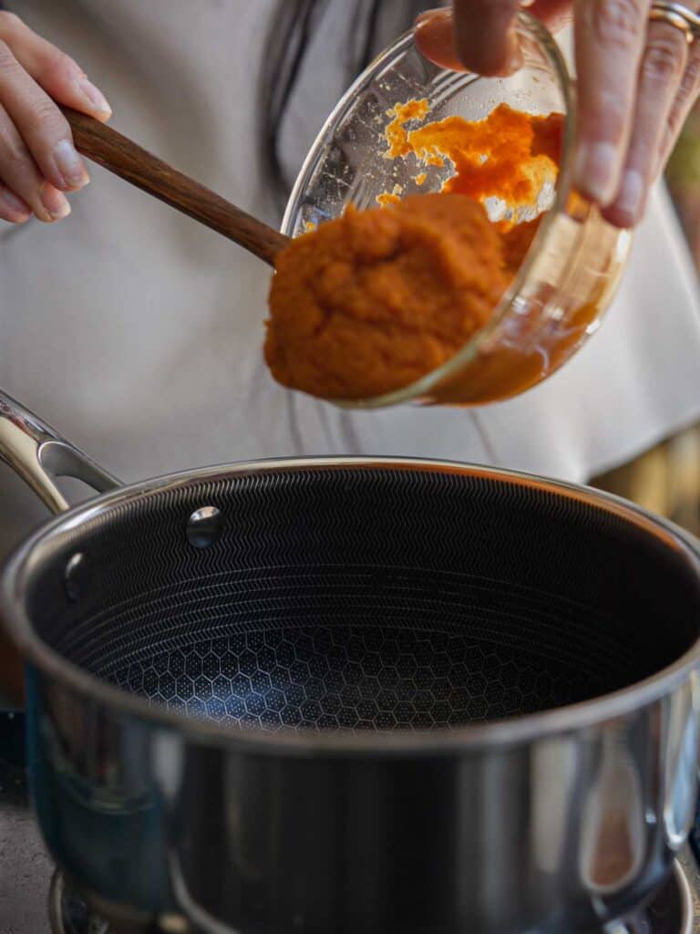 Easy Vegan Pumpkin Spice Syrup (Starbucks Copycat!). 4 adding pumpkin puree to pot