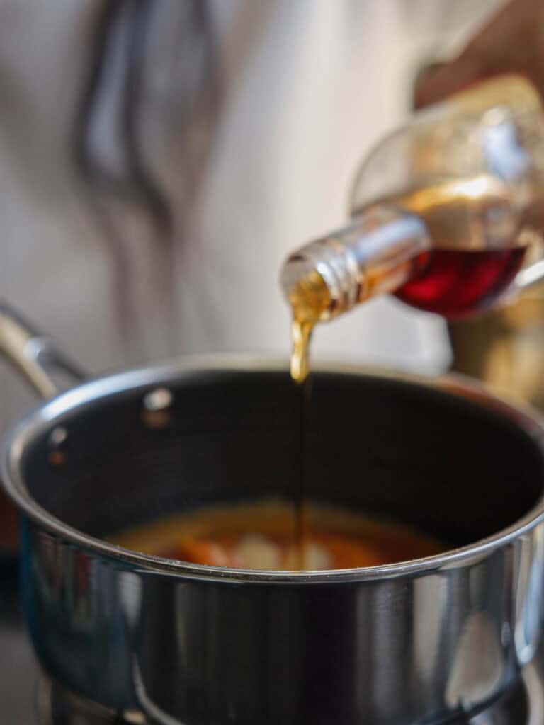 Easy Vegan Pumpkin Spice Syrup (Starbucks Copycat!). 7 adding maple syrup to pot