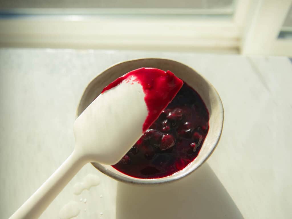 30-Minute Fluffy and Delicious Vegan Lemon Ricotta Pancakes. 9 finished blueberry sauce in bowl