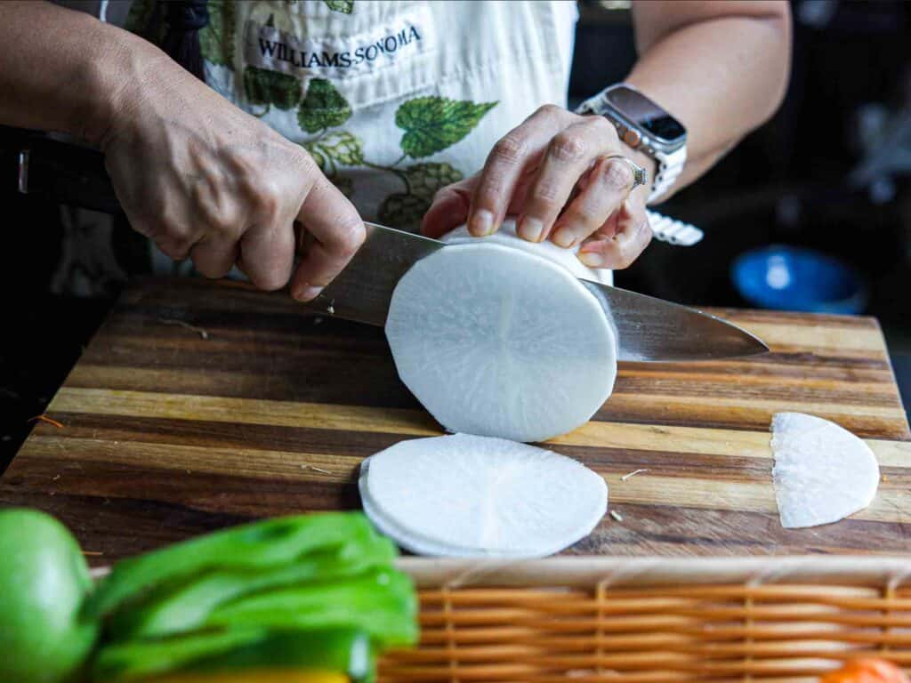 Easy & Spicy Korean Radish Salad - Musaengchae Recipe. 8 slicing korean radish into discs