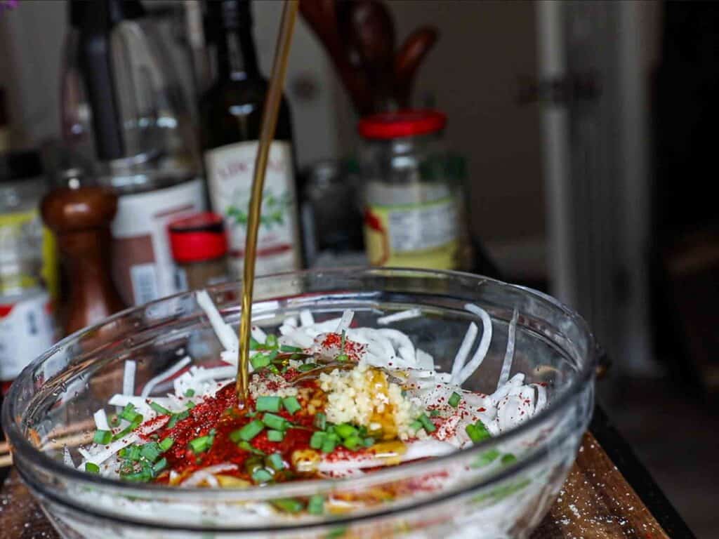 Easy & Spicy Korean Radish Salad - Musaengchae Recipe. 17 adding plum syrup to julienned radish