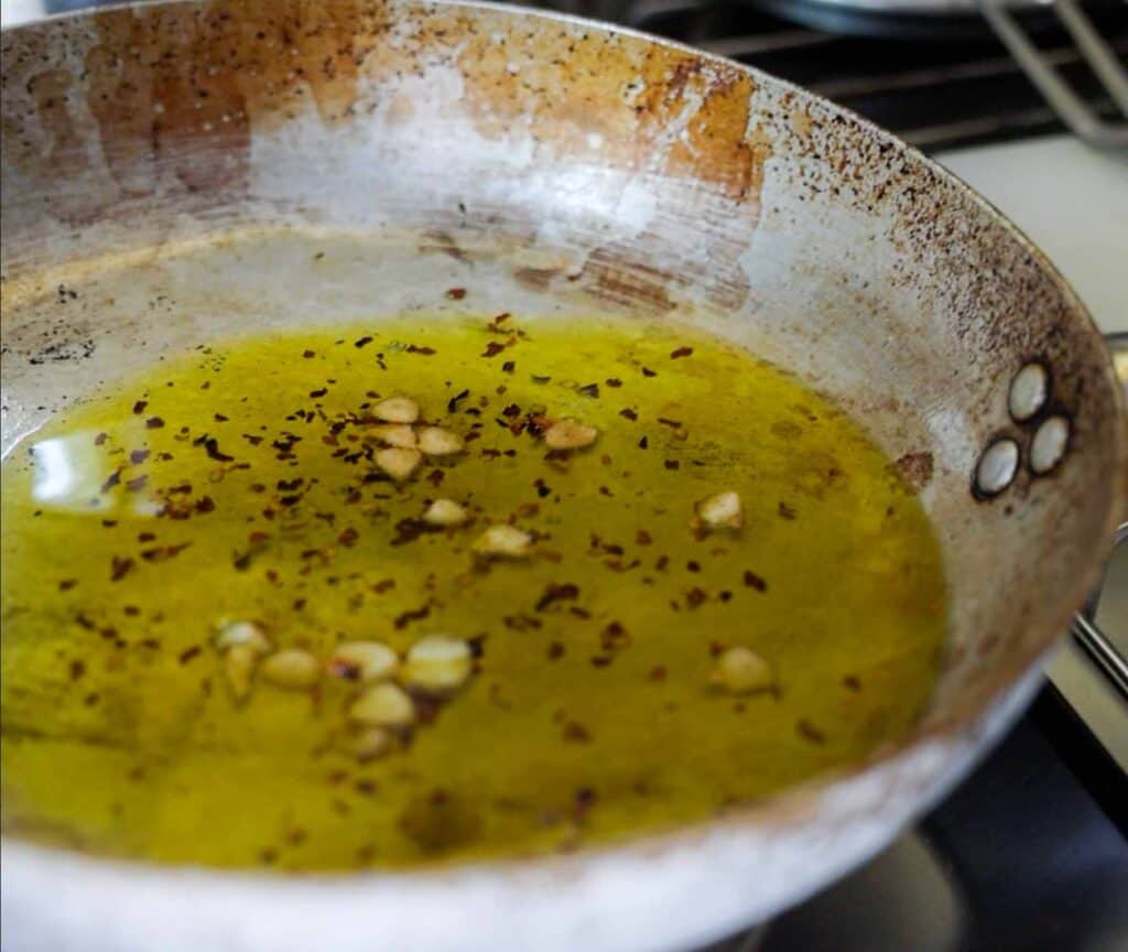 Spaghetti Aglio e Olio: The PERFECT 6-Ingredient Pasta Recipe. 13 garlic toasting in oil