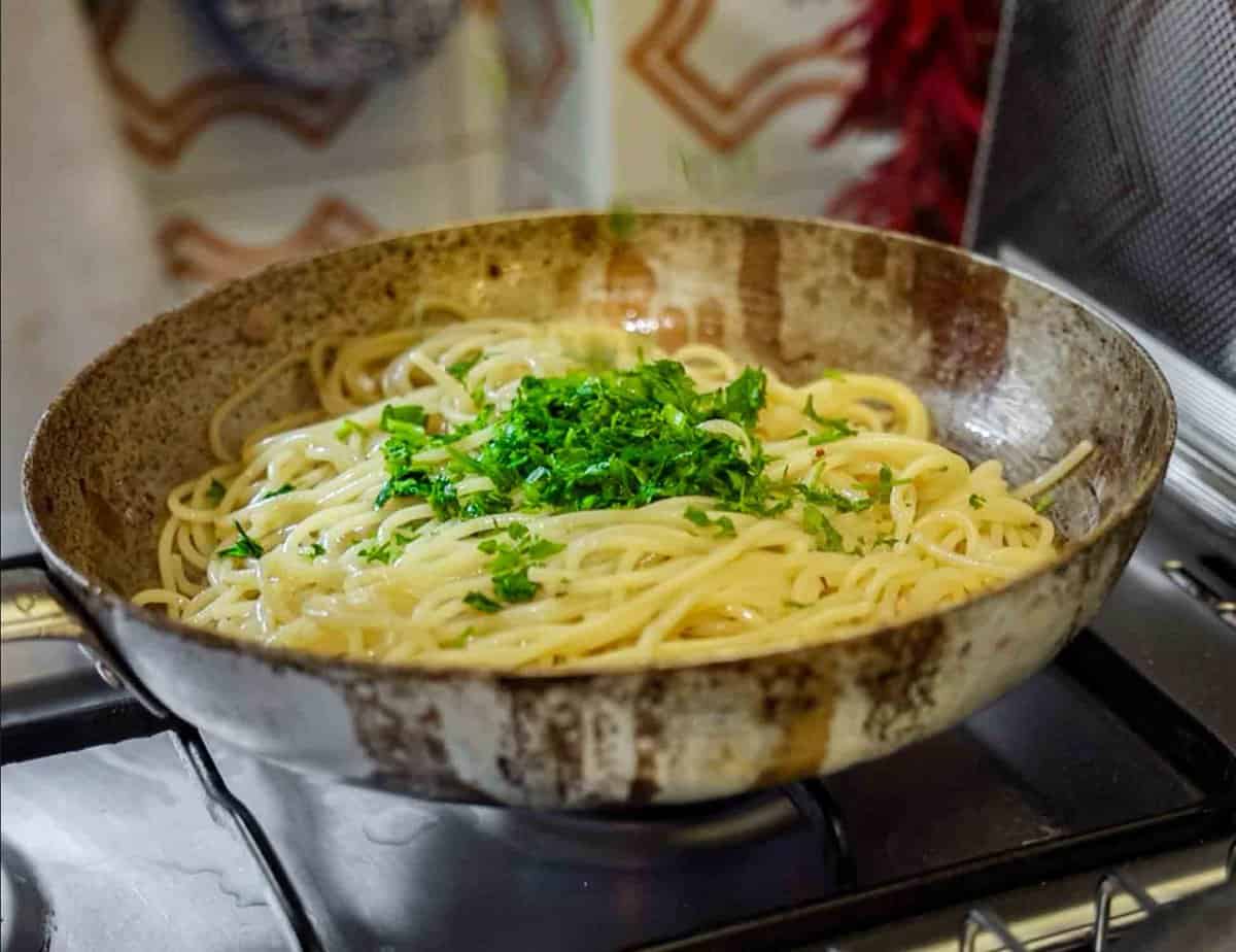 5-Ingredient Easy Chickpea Pasta Recipe (Pasta e Ceci). 18 adding flat leaf parsley to aglio e olio