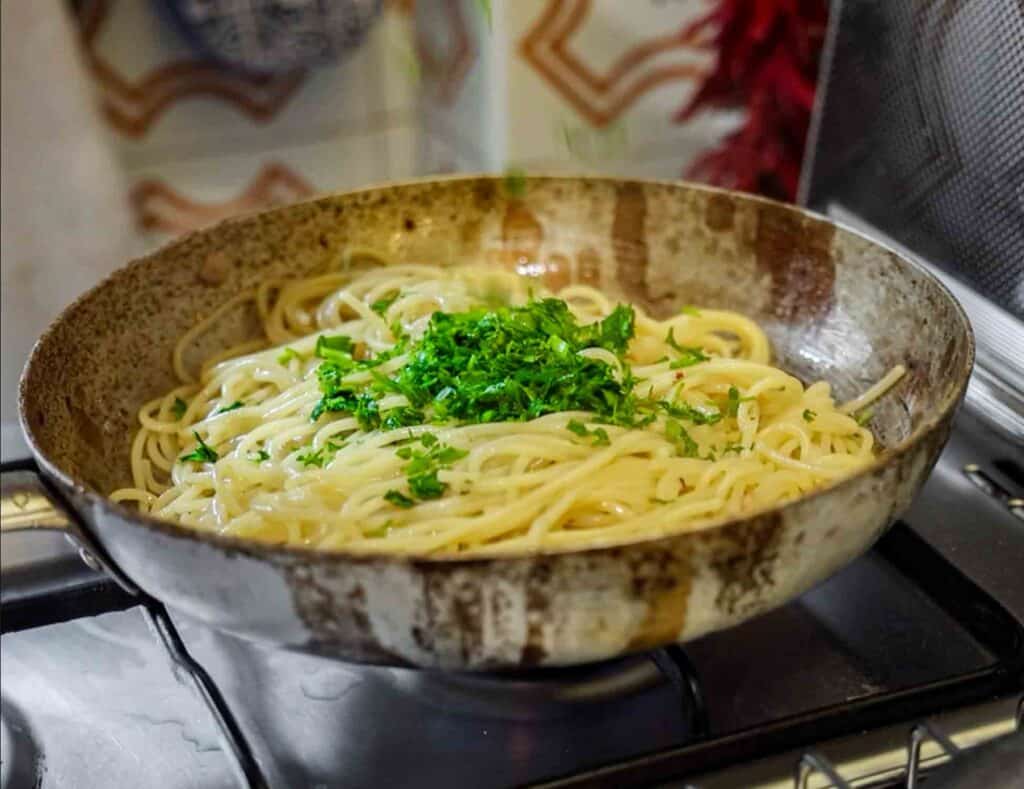 Spaghetti Aglio e Olio: The PERFECT 6-Ingredient Pasta Recipe. 16 adding flat leaf parsley to aglio e olio