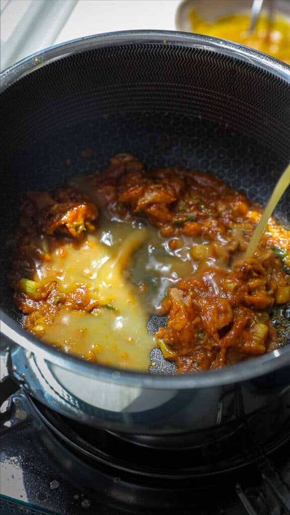 Easy Creamy and Spicy Pumpkin Ramen Recipe (Vegan). 19 adding vegetable broth to pot