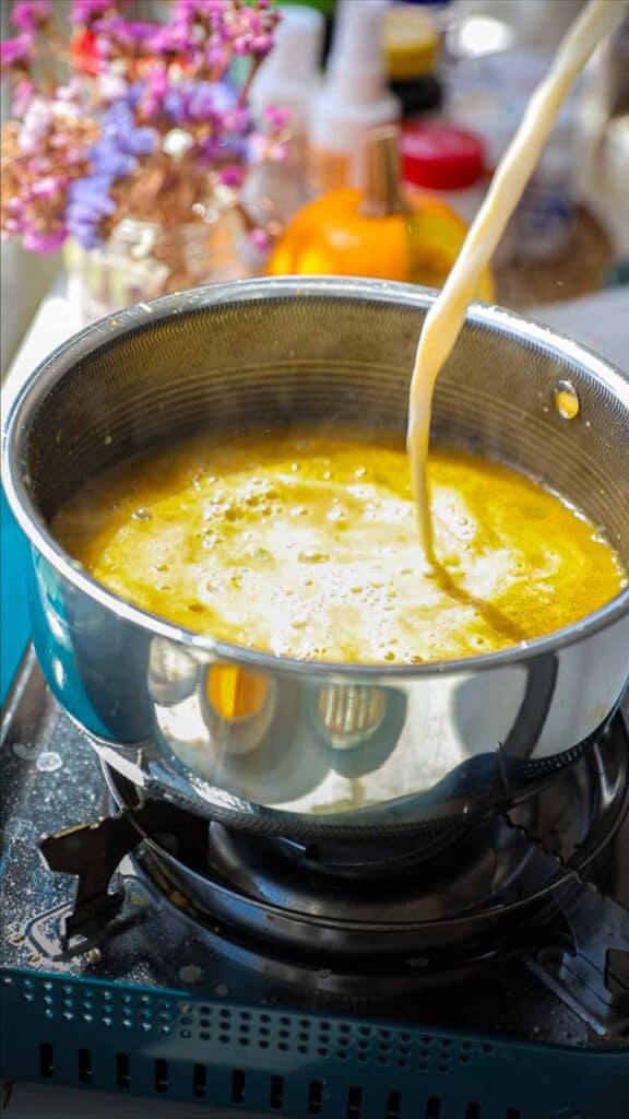 Easy Creamy and Spicy Pumpkin Ramen Recipe (Vegan). 20 adding soy milk to broth