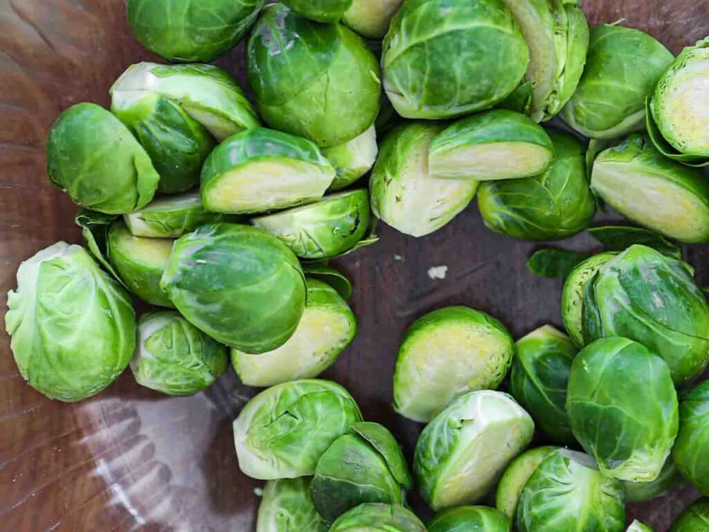 Tips on Making PERFECT Roasted Brussels Sprouts (Easy and Delicious)! 6 raw halved brussels sprouts