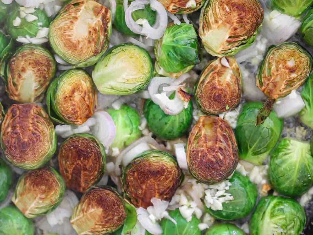 Tips on Making PERFECT Roasted Brussels Sprouts (Easy and Delicious)! 13 seared brussels sprouts in wine reduction and shallots