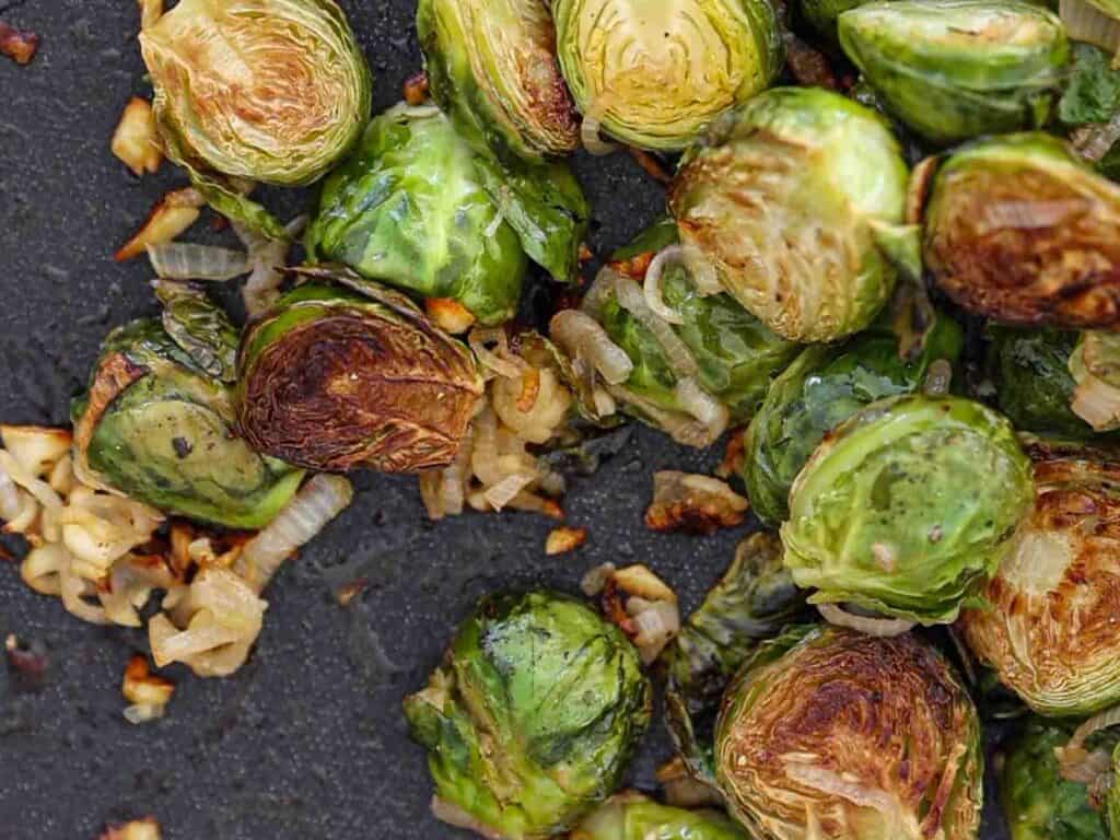 Tips on Making PERFECT Roasted Brussels Sprouts (Easy and Delicious)! 14 image of roasted brussels sprouts on sheet pan