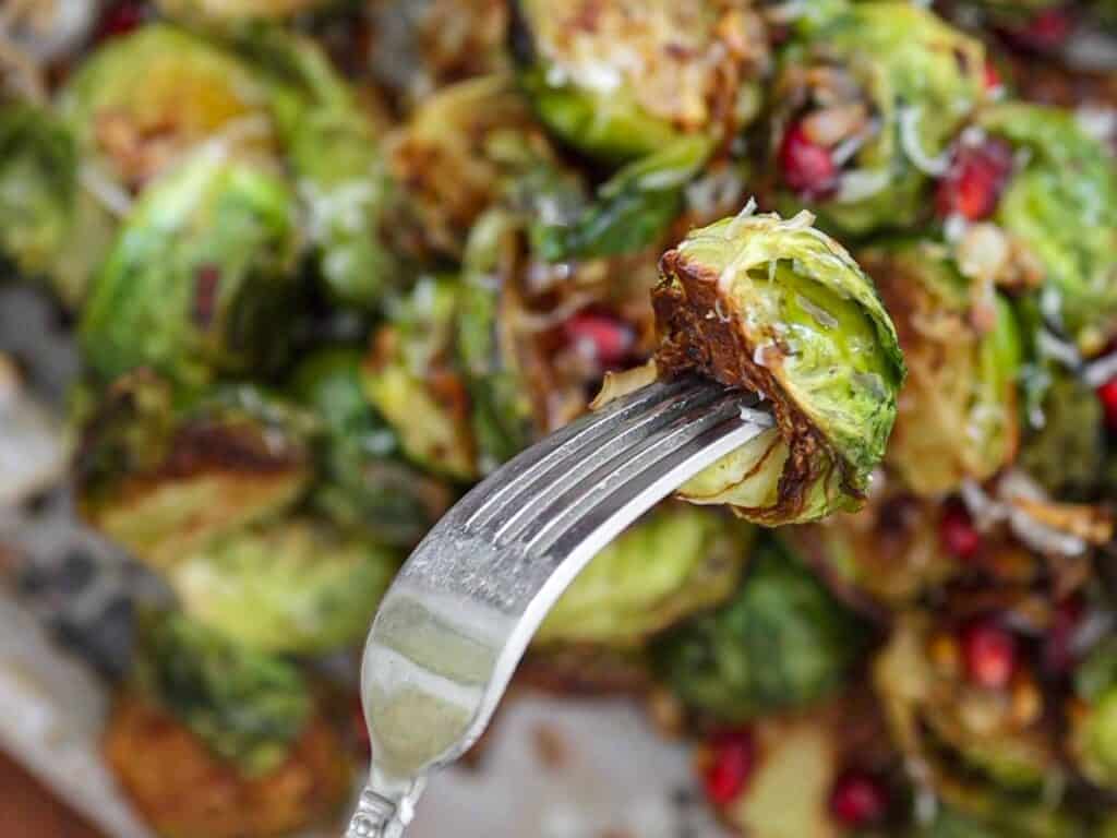 Tips on Making PERFECT Roasted Brussels Sprouts (Easy and Delicious)! 2 close up of roasted brussels sprouts on fork