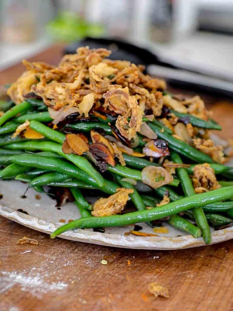 The BEST Green Beans with French Fried Shallots and Toasted Almonds. 2 side view of green beans with French fried shallots