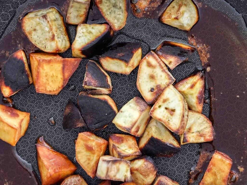 6-Ingredient Delicious Candied Korean Sweet Potatoes or Matang. 16 close up image of korean sweet potatoes in pan