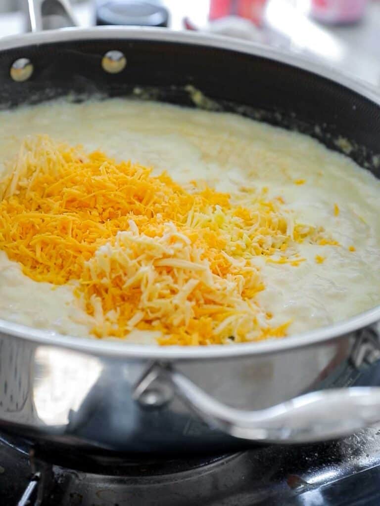 The Creamiest and BEST Vegan Mac 'n Cheese Casserole Recipe. 15 adding cheese to cream sauce