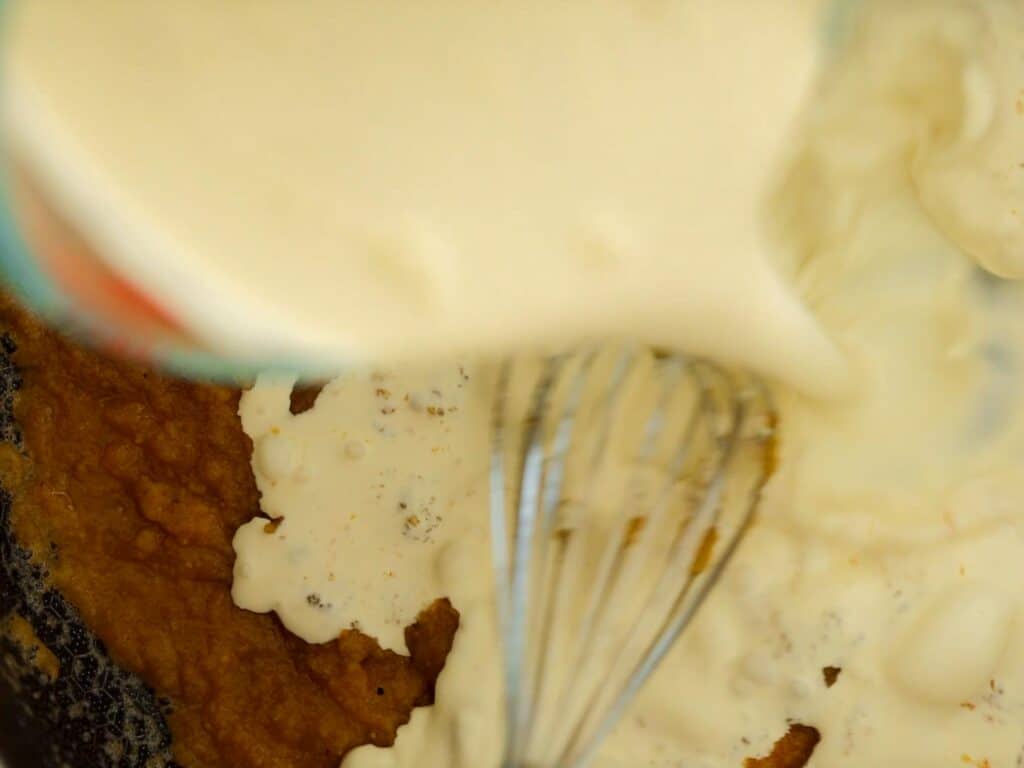The Creamiest and BEST Vegan Mac 'n Cheese Casserole Recipe. 6 adding milk and cream to roux