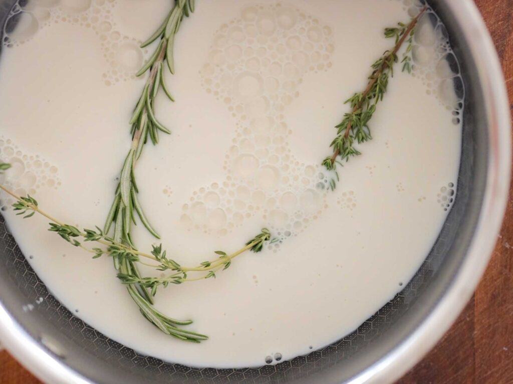 Tips on Making the BEST Creamy Mashed Potatoes (Dairy Free Option)! 8 thyme and rosemary in milk