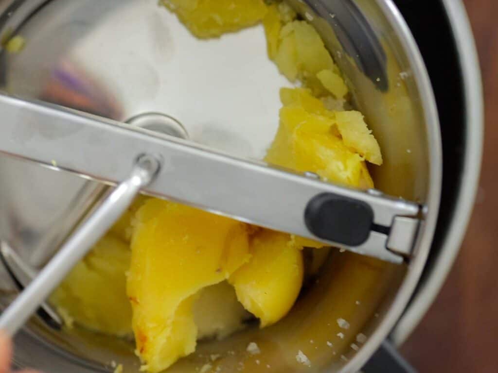 Tips on Making the BEST Creamy Mashed Potatoes (Dairy Free Option)! 12 potatoes in food mill