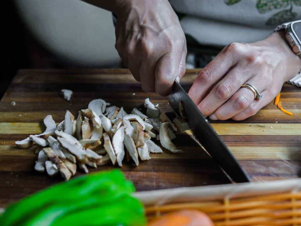 My Mom's Easy Vegetarian Japchae (Glass Noodles). 13 slicing shiitake mushrooms