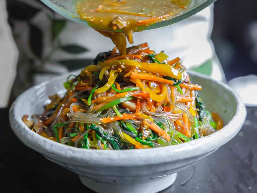 My Mom's Easy Vegetarian Japchae (Glass Noodles). 27 adding broth to vegetarian japchae