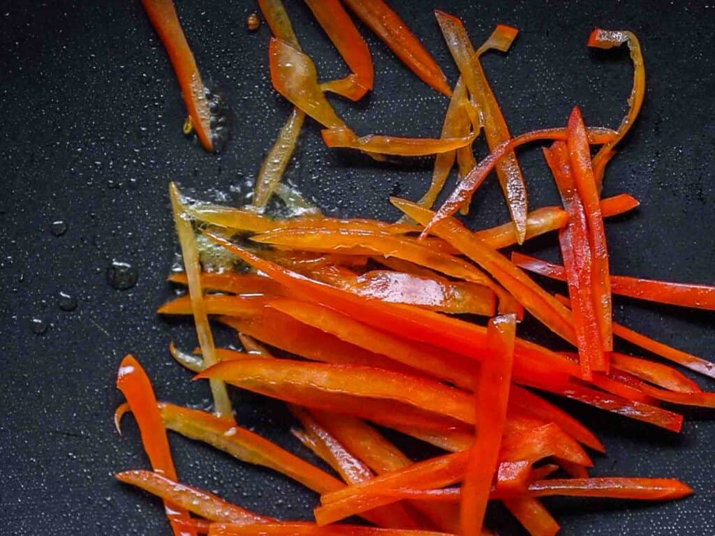 My Mom's Easy Vegetarian Japchae (Glass Noodles). 17 sauteed red bell pepper