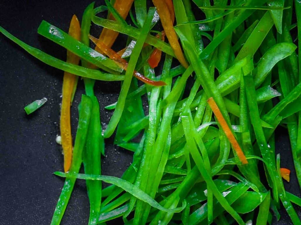 My Mom's Easy Vegetarian Japchae (Glass Noodles). 18 sauteed green bell pepper