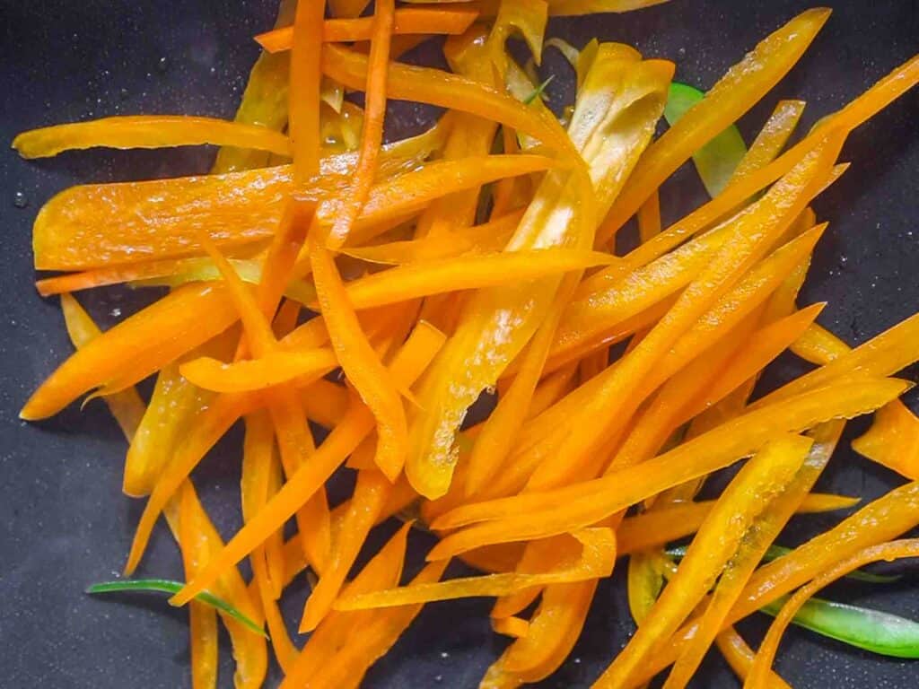 My Mom's Easy Vegetarian Japchae (Glass Noodles). 19 sauteed orange bell pepper