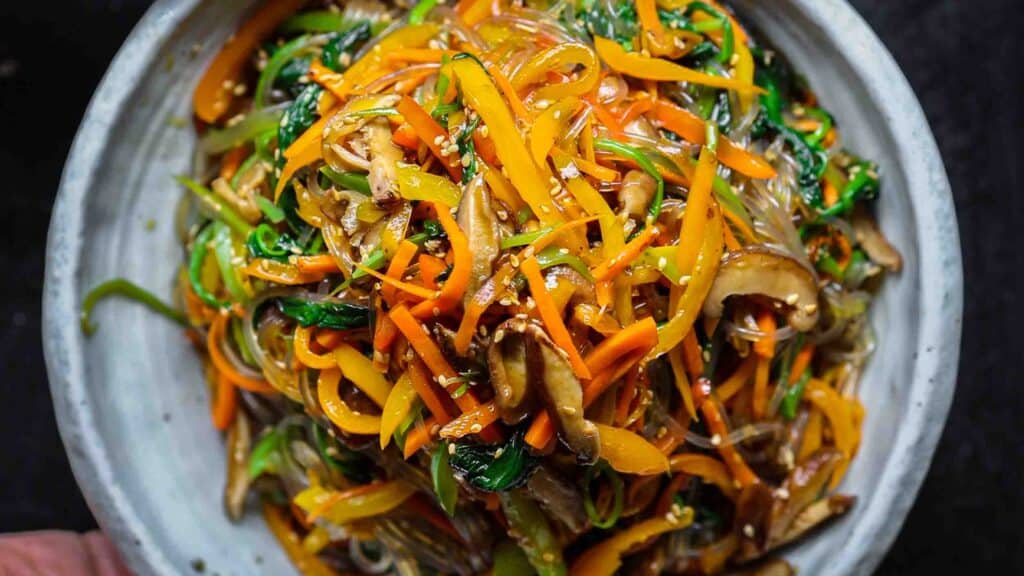 My Mom's Easy Vegetarian Japchae (Glass Noodles). 1 hero image of vegetarian japchae
