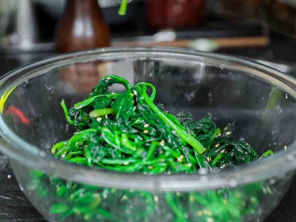 My Mom's Easy Vegetarian Japchae (Glass Noodles). 9 seasoned spinach for vegetarian japchae