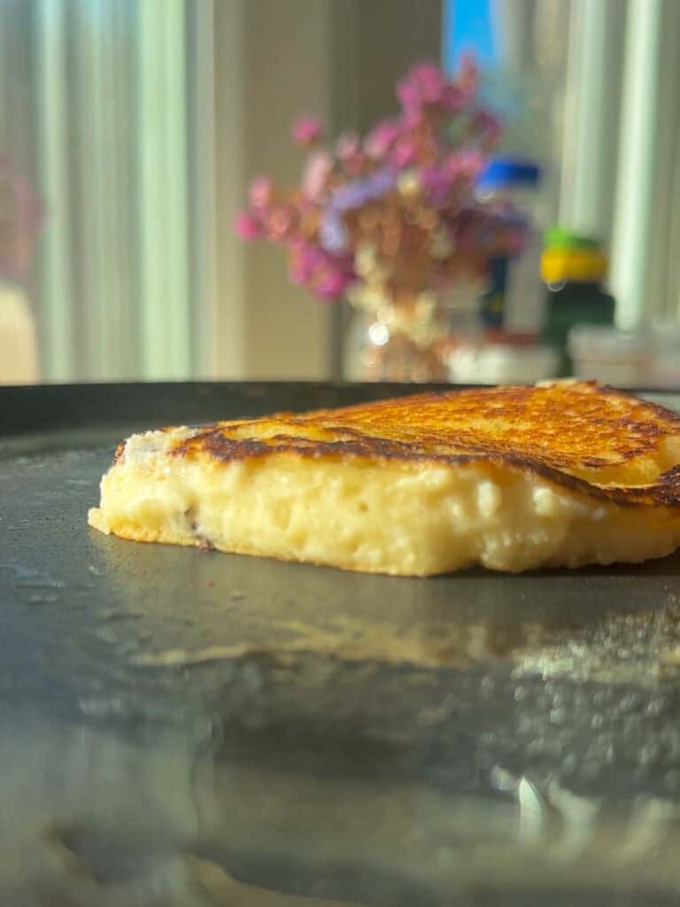 30-Minute Fluffy and Delicious Vegan Lemon Ricotta Pancakes. 22 side view of vegan lemon ricotta pancake