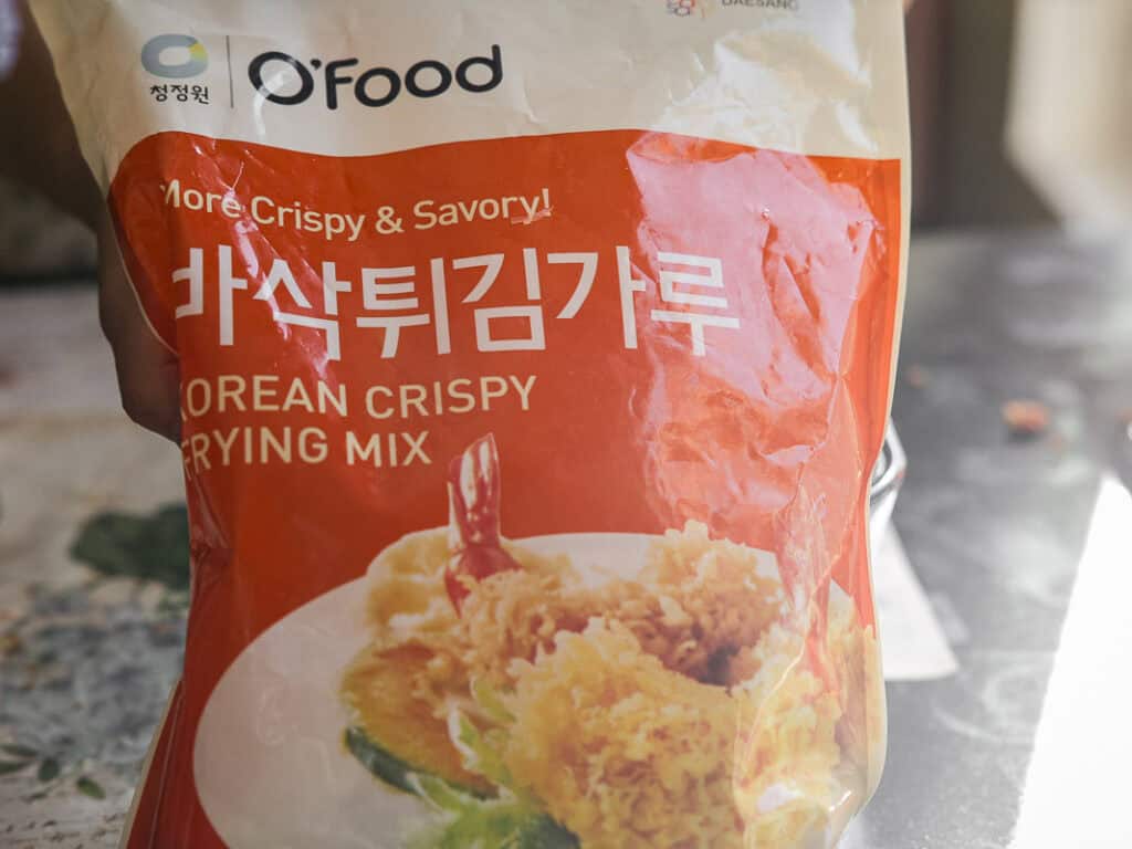 The BEST Vegan Lasagna Recipe - Easy and Delicious. 9 A bag of OFood Korean Crispy Frying Mix with red and white packaging. The front features an image of fried shrimp and vegetables. Text on the bag highlights More Crispy & Savory!.