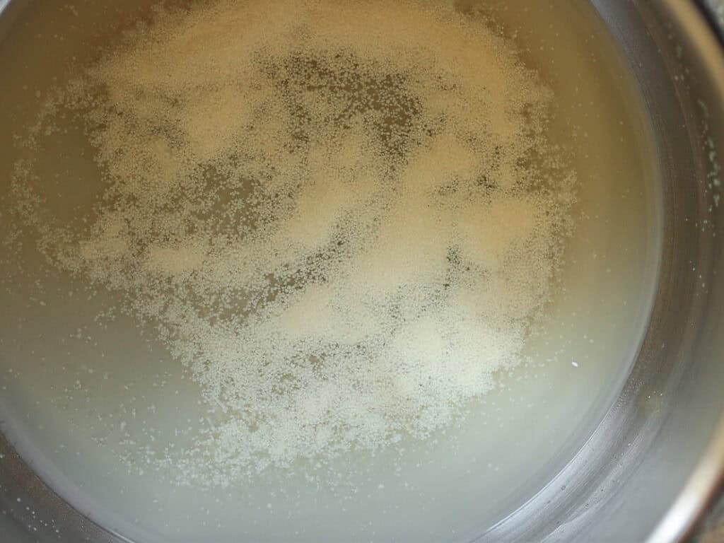 Perfect Roasted Garlic Vegan Dinner Rolls Recipe. 11 Proofed yeast in stand mixer bowl.