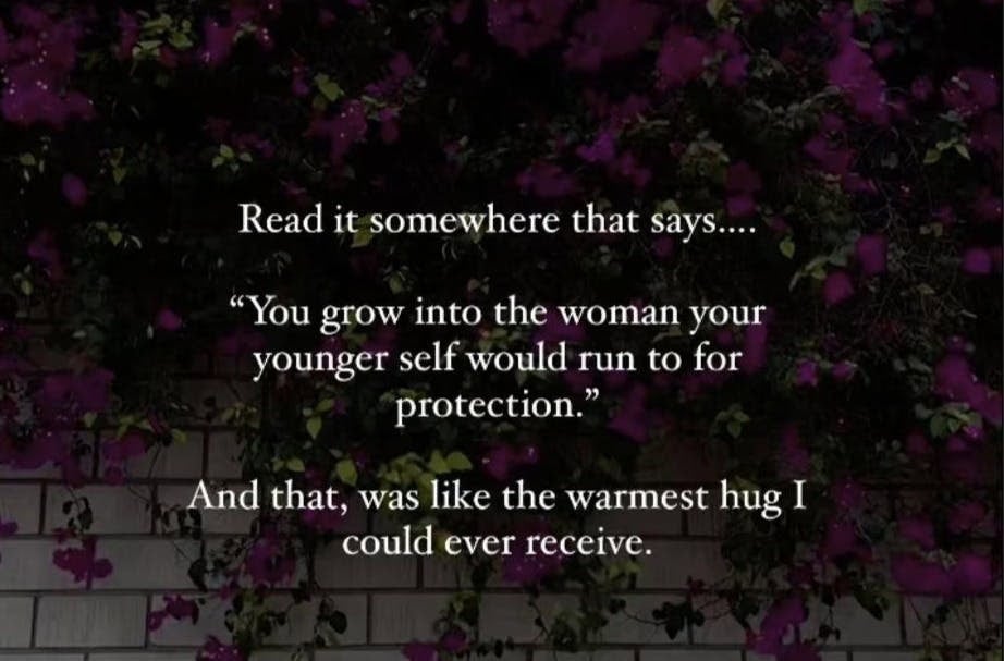 Is Therapy Speak Out of Control? 3 A wall covered with dark purple flowers and greenery. The text reads: Read it somewhere that says... You grow into the woman your younger self would run to for protection. It's like therapy language wrapped in the warmest hug I could ever receive.