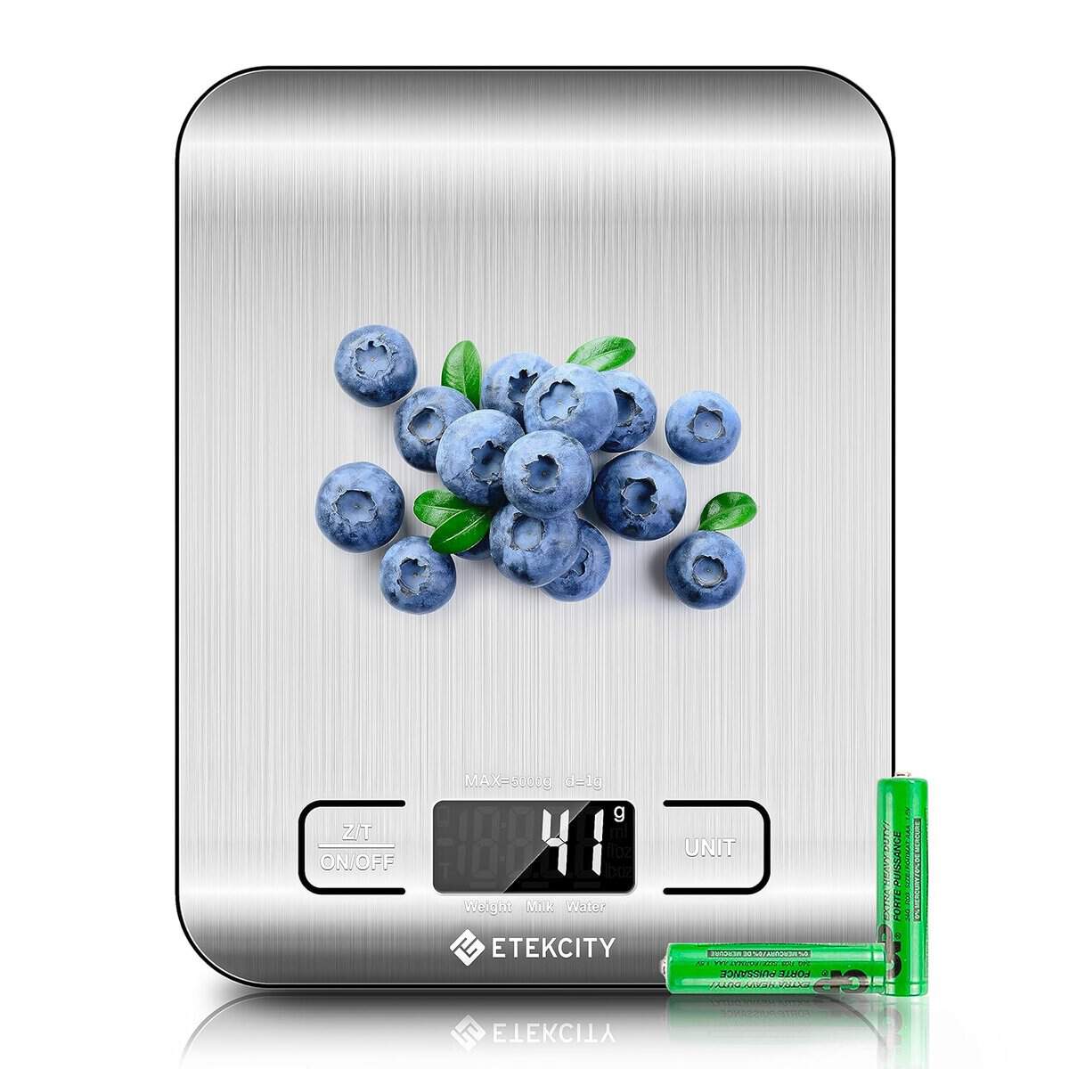 The Korean Vegan's 2025 VEGAN Holiday Gift GUIDE. 10 A digital kitchen scale, perhaps the perfect addition to a Korean Vegan's arsenal, displays 41 grams with a cluster of blueberries on its stainless steel surface. Two green AAA batteries sit beside it—a thoughtful choice for any Holiday Gift.