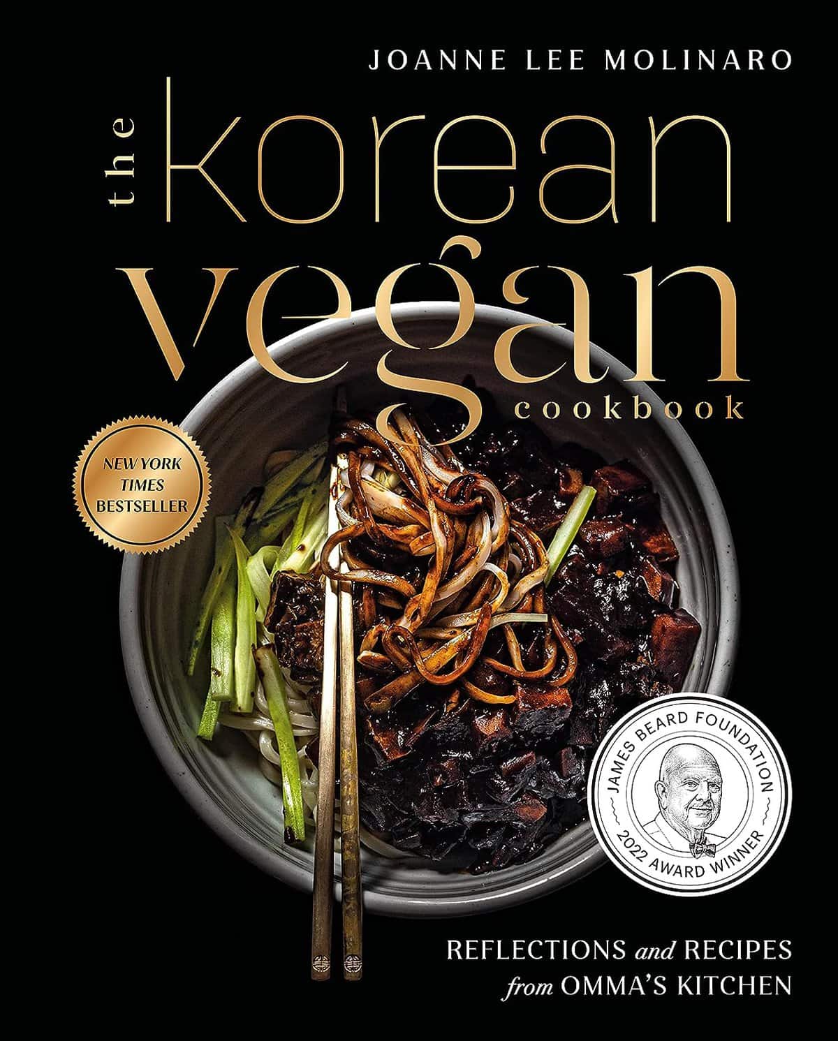 The Korean Vegan's 2025 VEGAN Holiday Gift GUIDE. 3 Cover of The Korean Vegan Cookbook by Joanne Lee Molinaro. This essential guide features a bowl of noodles with vegetables and chopsticks, perfect for a holiday gift. Includes text: New York Times Bestseller and James Beard Foundation 2022 Award Winner.