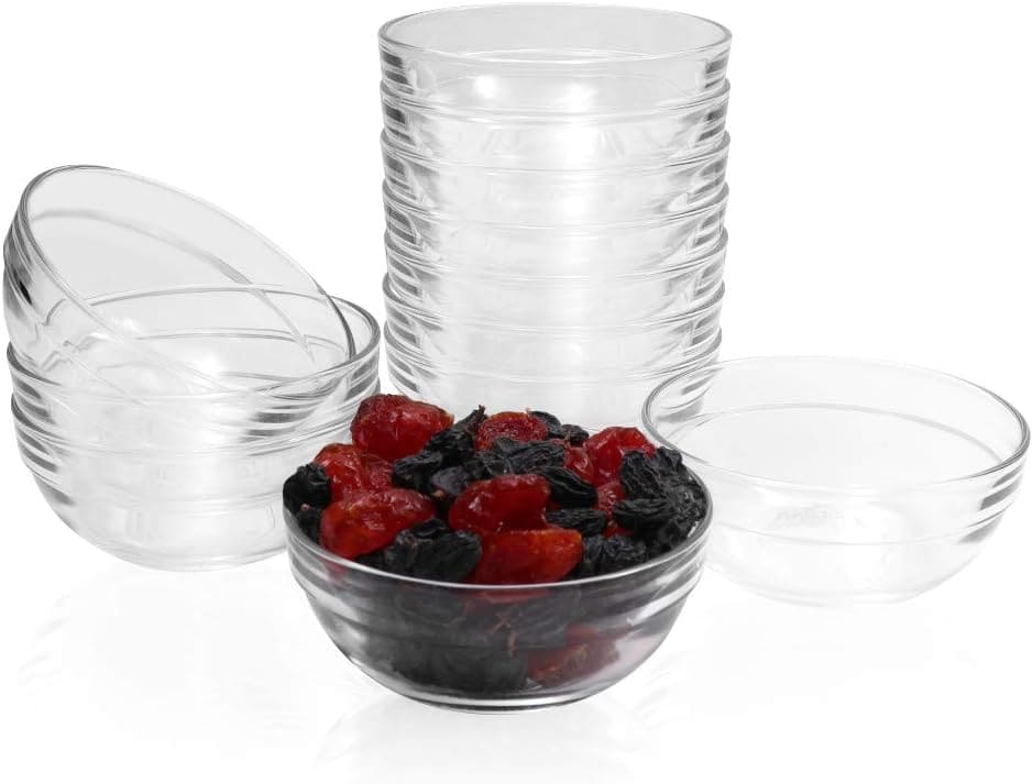 The Korean Vegan's 2025 VEGAN Holiday Gift GUIDE. 7 A set of seven clear glass bowls, six stacked neatly while one displays vibrant red and black dried fruits. With their simple design and ridged exterior, they make an elegant addition to any table.