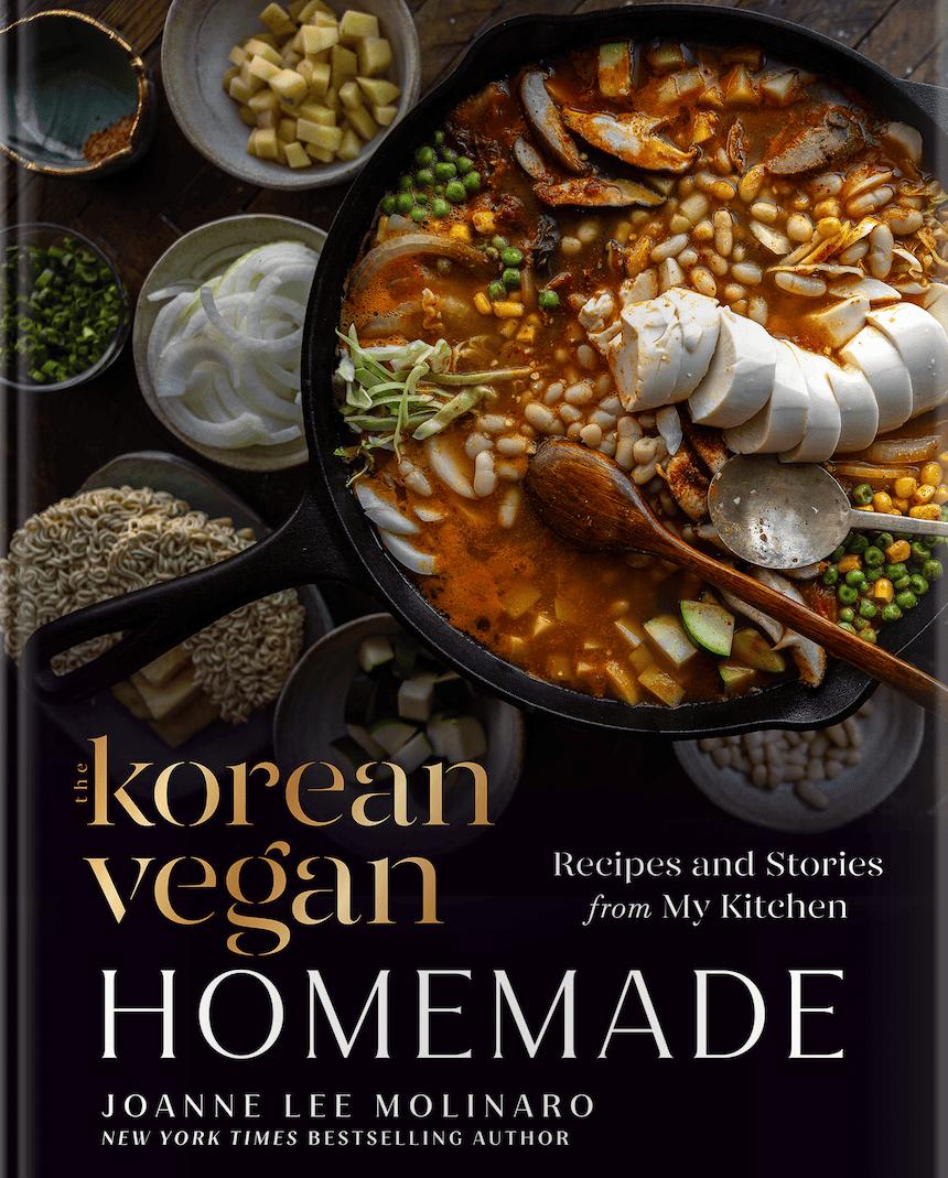 Home 10 The book cover titled The Korean Vegan: Homemade by Joanne Lee Molinaro beautifully highlights a skillet of vibrant Korean stew filled with beans, sliced tofu, mushrooms, and green peas.